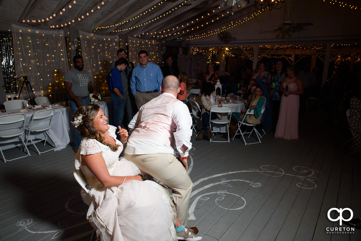 Groom grinding on the bride.