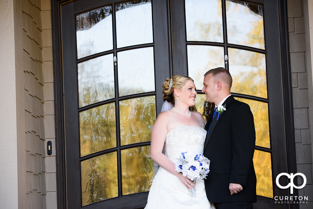 Bride and groom looking at each other after their wedding at the hollow at Paris mountain.