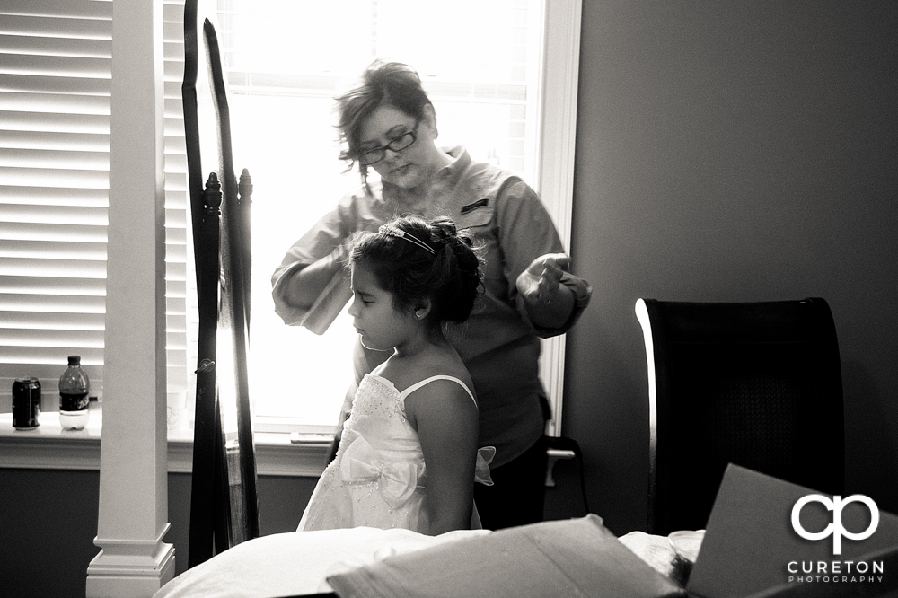 Flower girl getting her hair done.