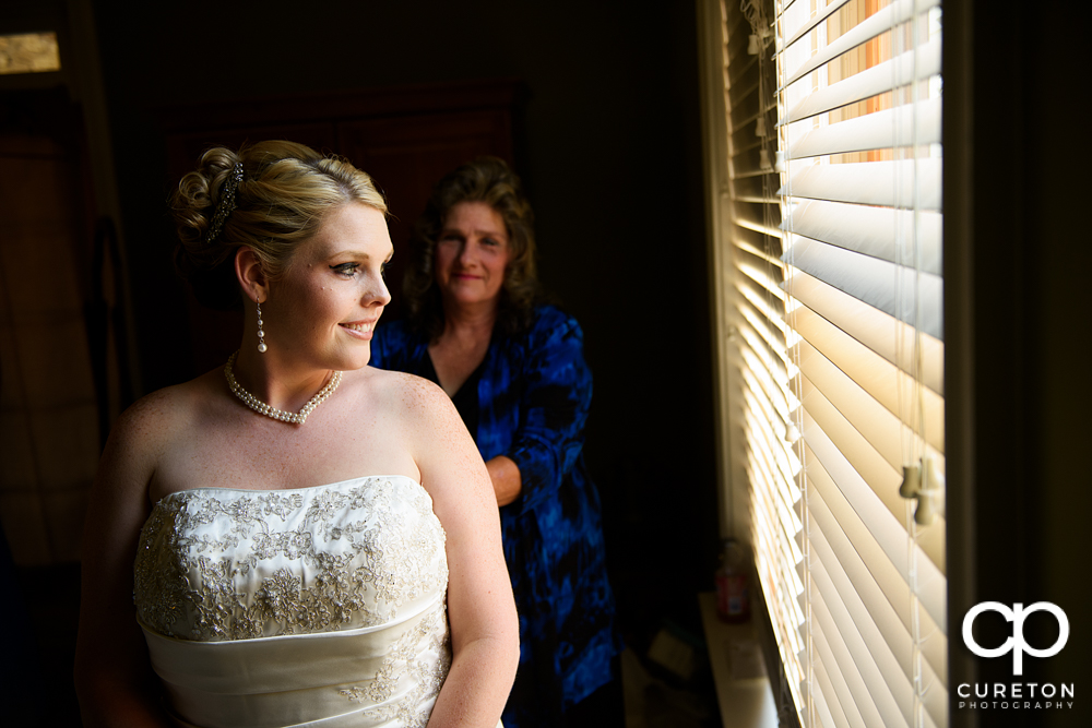 The bride staring out the window.