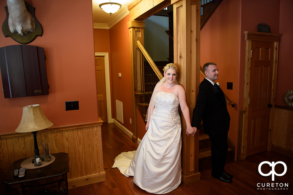 The bride and groom sharing a first touch.