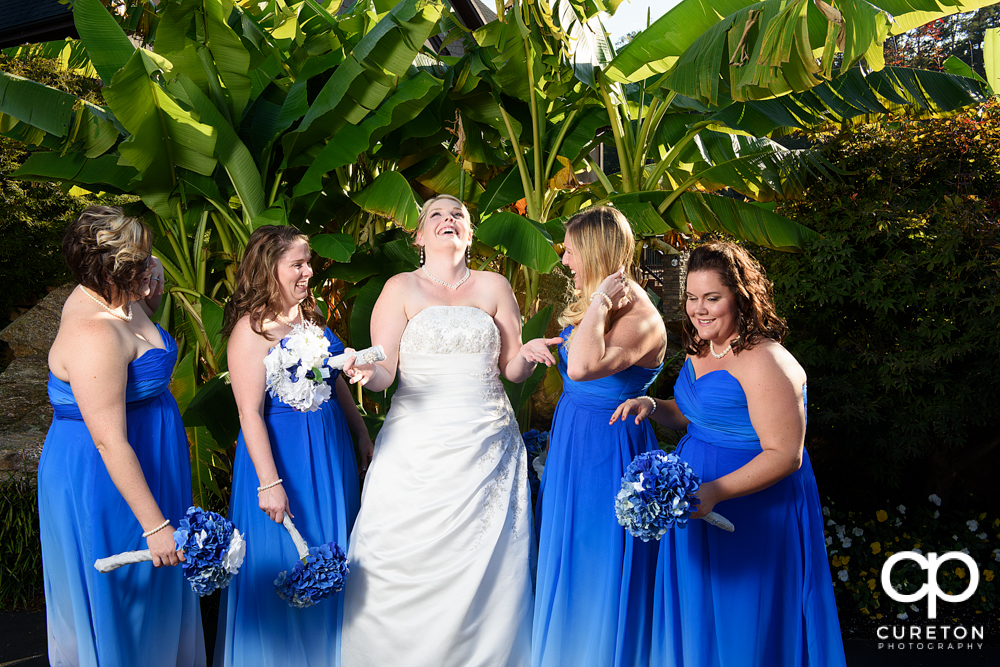 Bride and bridesmaids having fun.