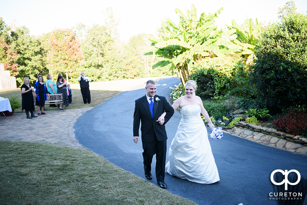 Bride and groom getting introduced to their ceremony.