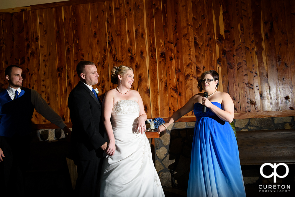 Bridesmaid toasting the newly married couple.