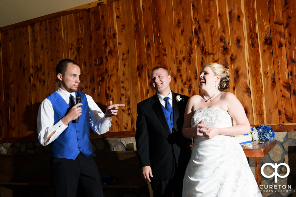 Best man giving a toast at the wedding reception.