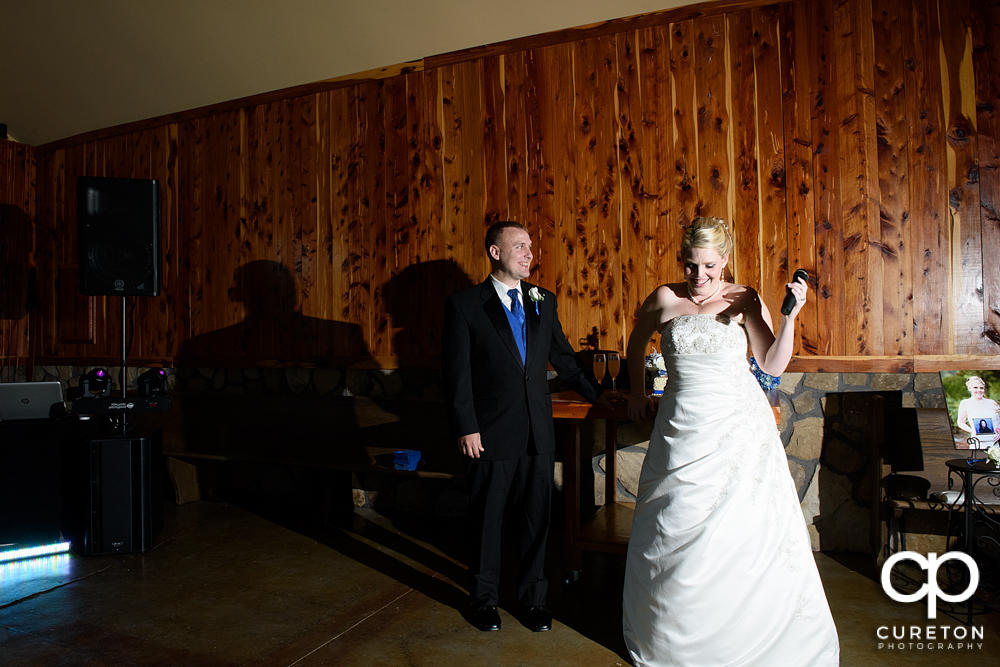 Bride and groom welcoming guests to their wedding.