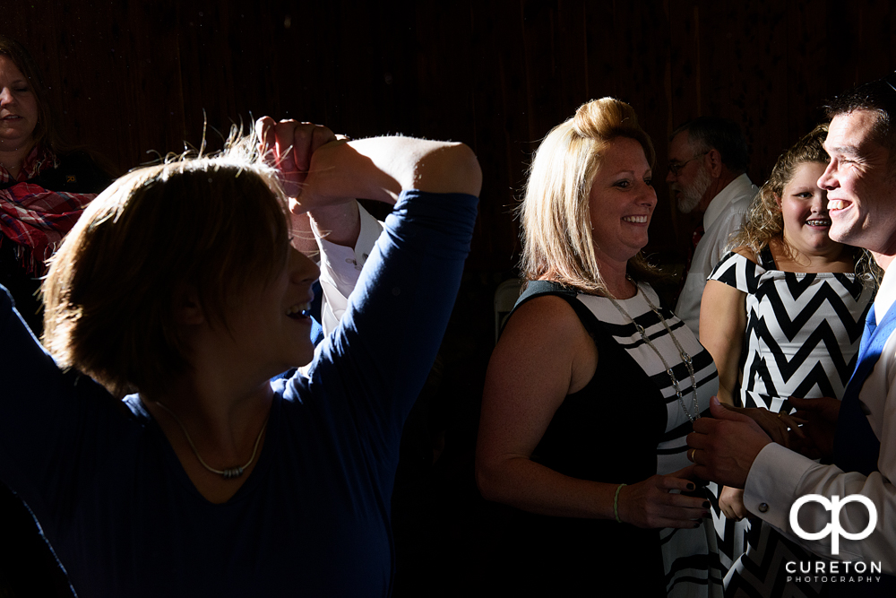 Guests dancing to the sounds of Parker entertainment at the wedding reception.