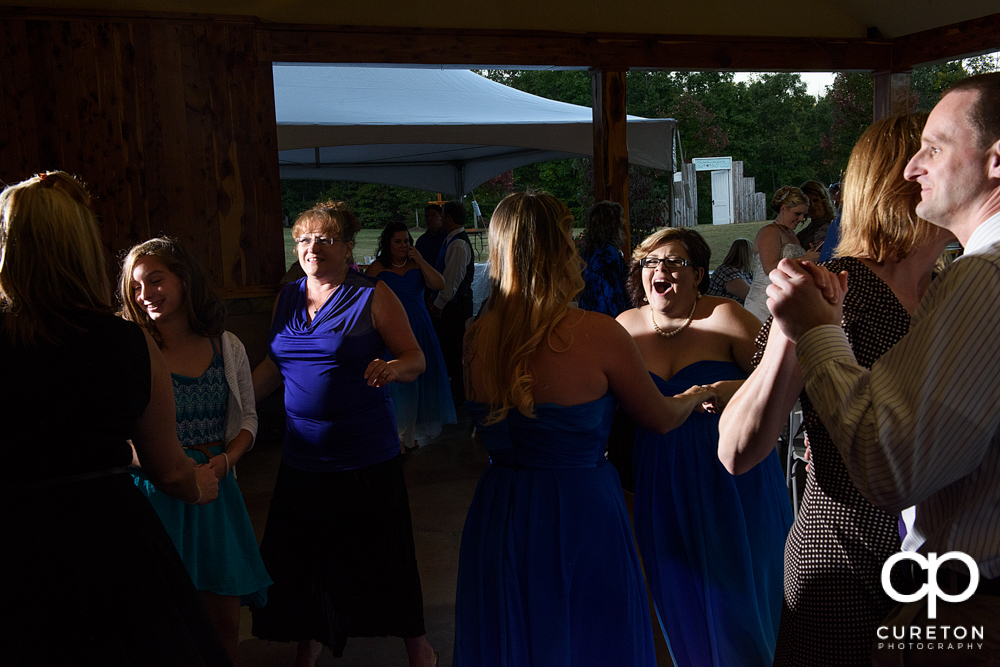 Guests dancing to the sounds of Parker entertainment at the wedding reception.