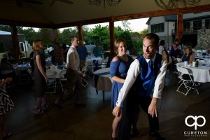 Guests dancing to the sounds of Parker entertainment at the wedding reception.