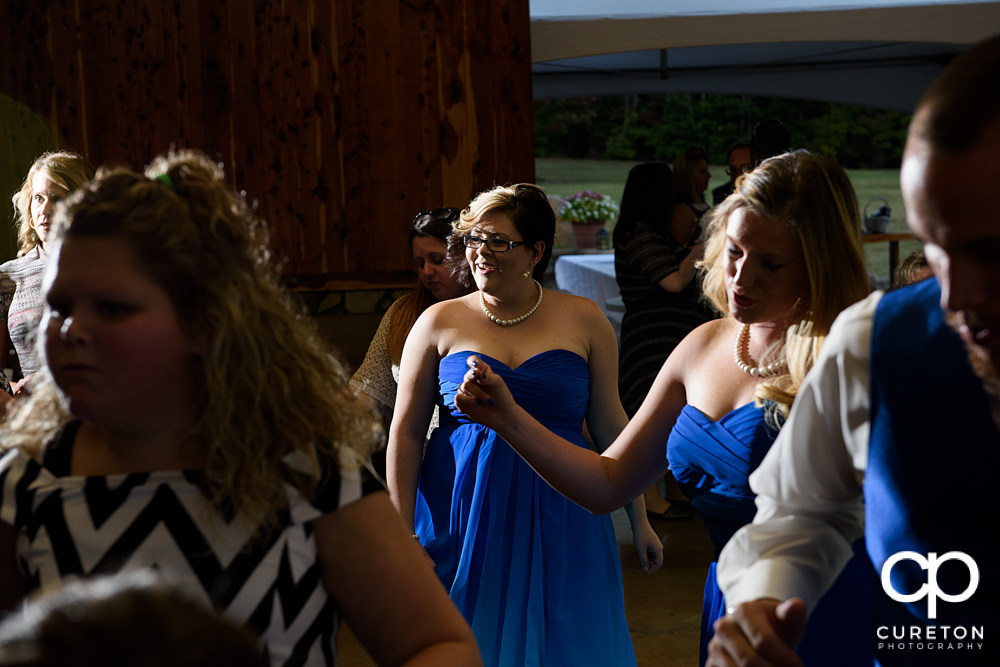 Guests dancing to the sounds of Parker entertainment at the wedding reception.