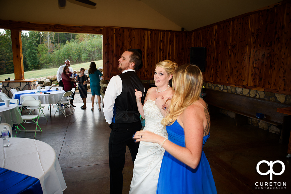 Guests dancing to the sounds of Parker entertainment at the wedding reception.