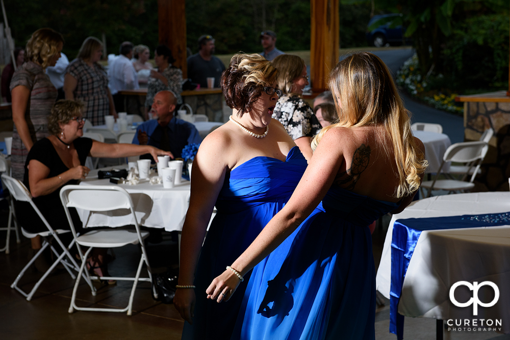 Guests dancing to the sounds of Parker entertainment at the wedding reception.