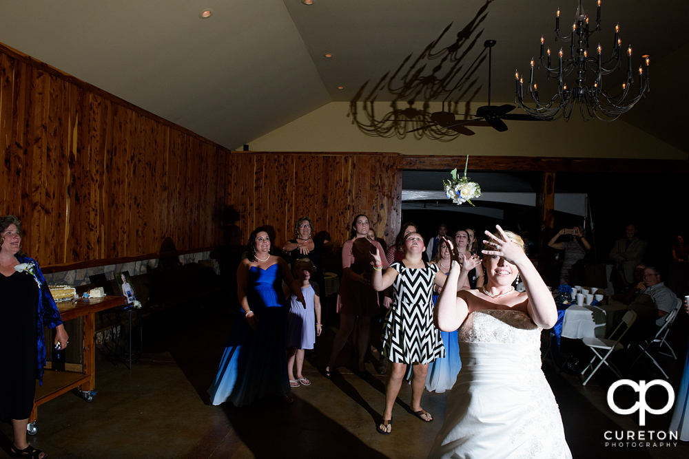 Bride tossing her bouquet.