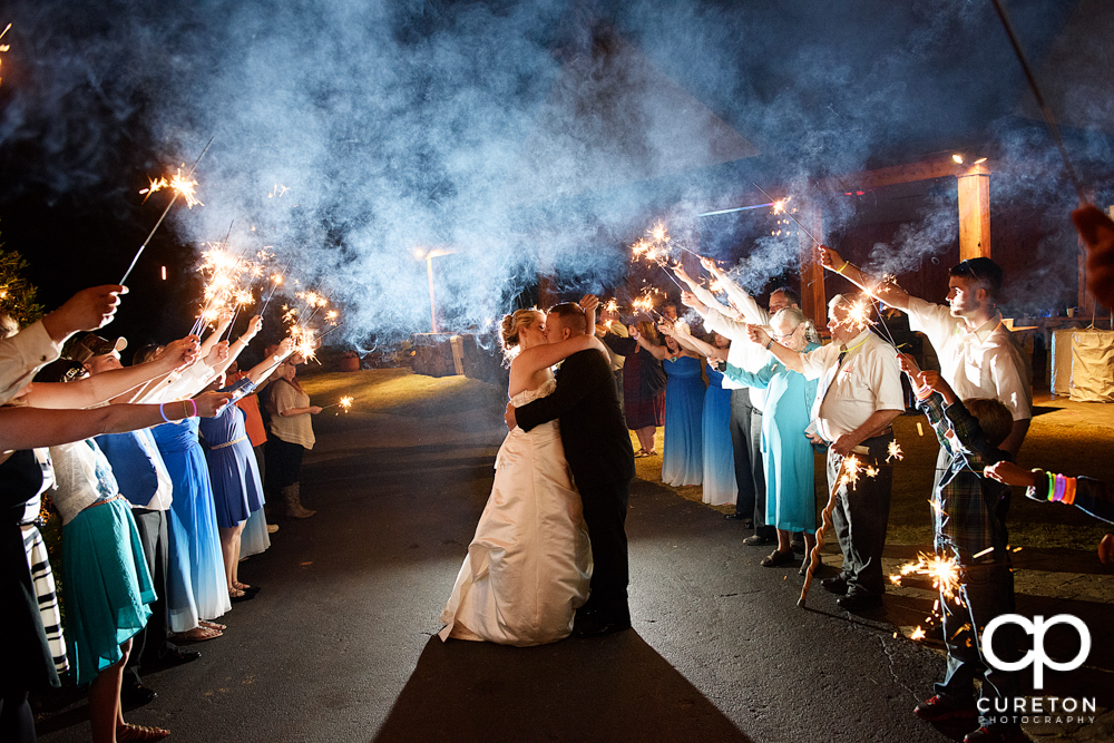 Sparkler leave after the wedding at the hollow at Paris mountain in Greenville South Carolina.