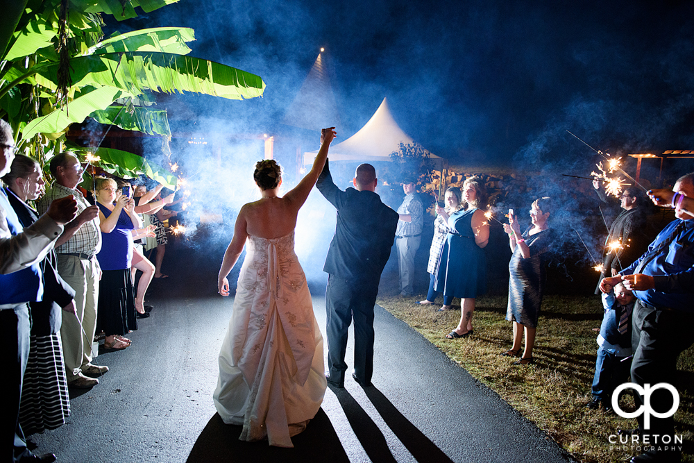 Sparkler leave after the wedding at the hollow at Paris mountain in Greenville South Carolina.