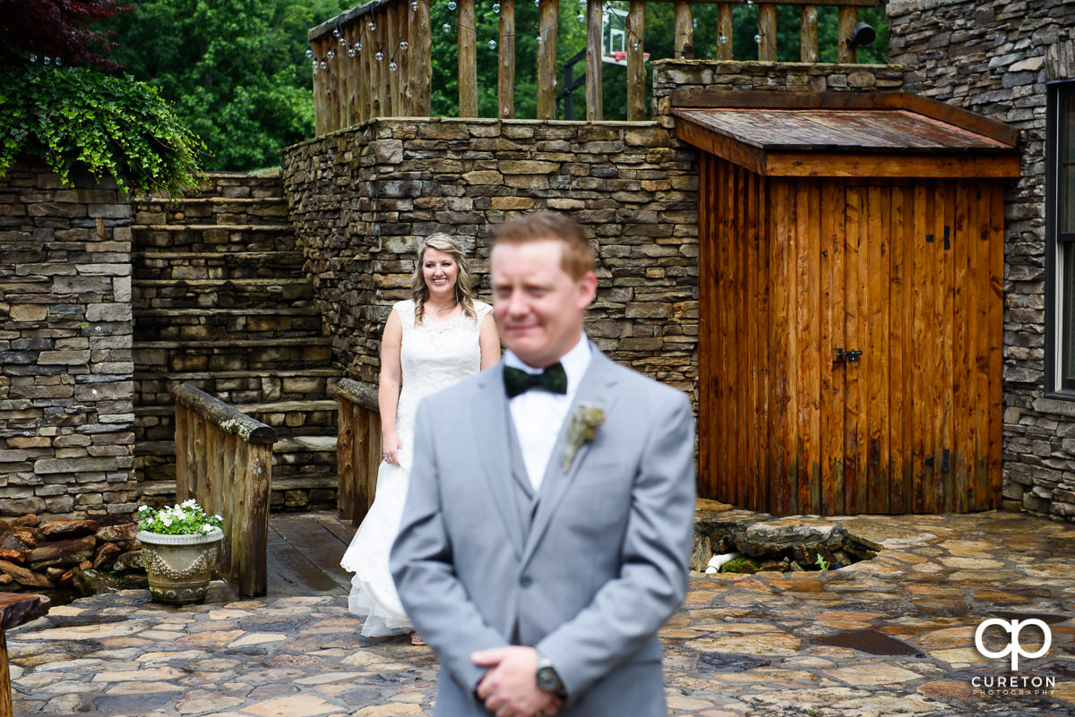 Bride waiting on a first look with her groom.