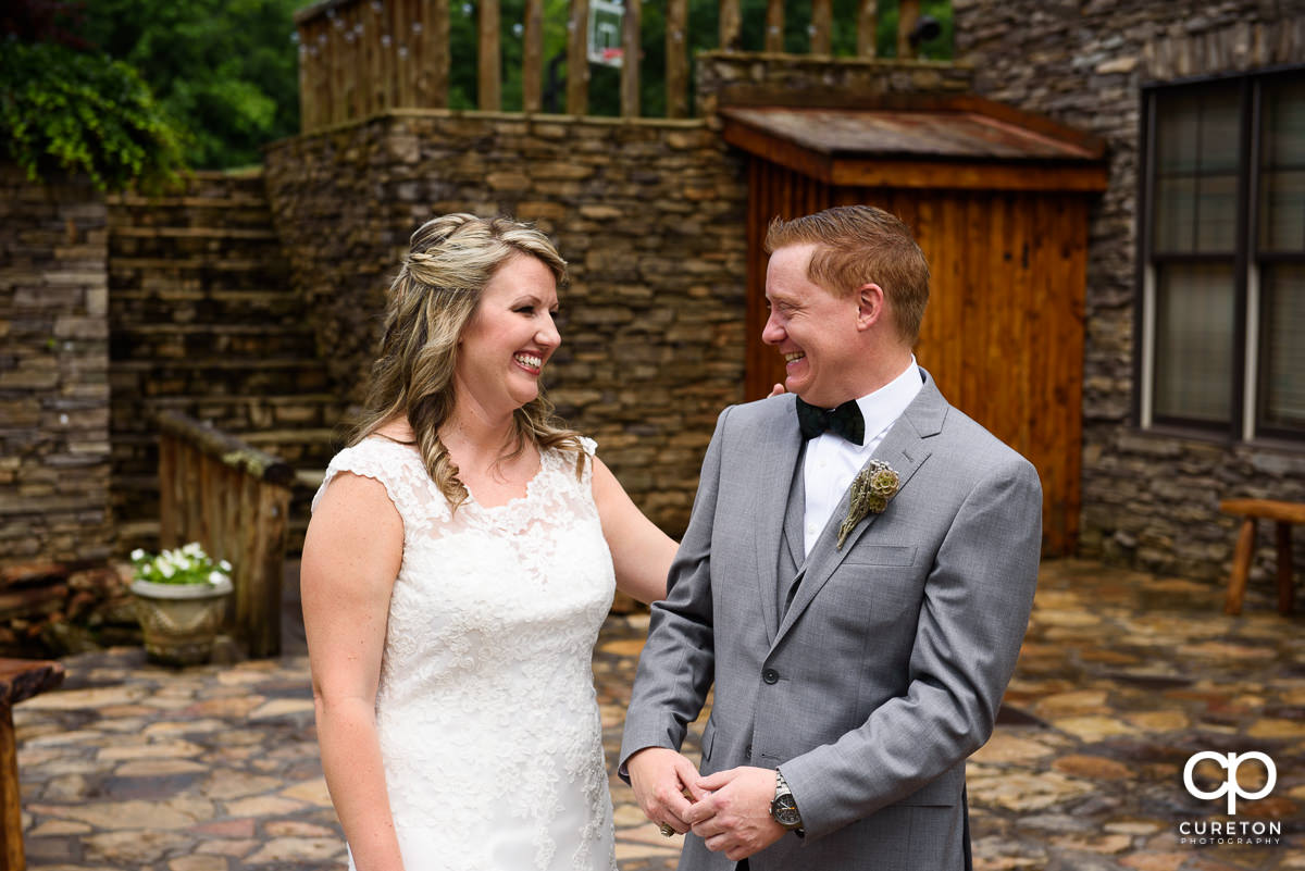 Bride and groom sharing a first look before the wedding ceremony.