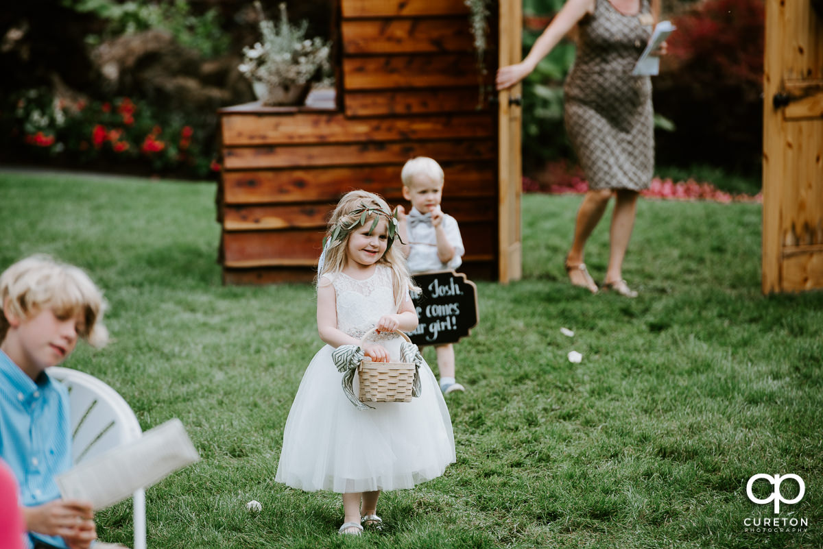 Flower girl walking down the aisle.