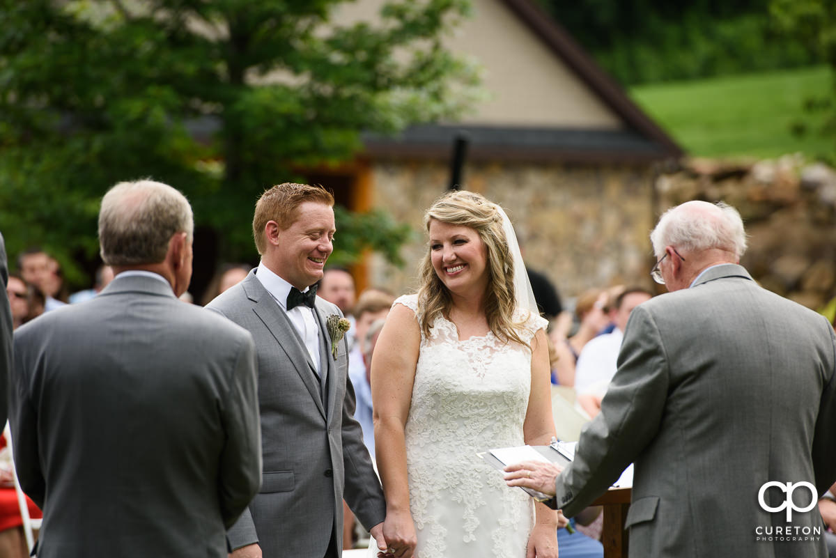 Bride smiling at her groom.