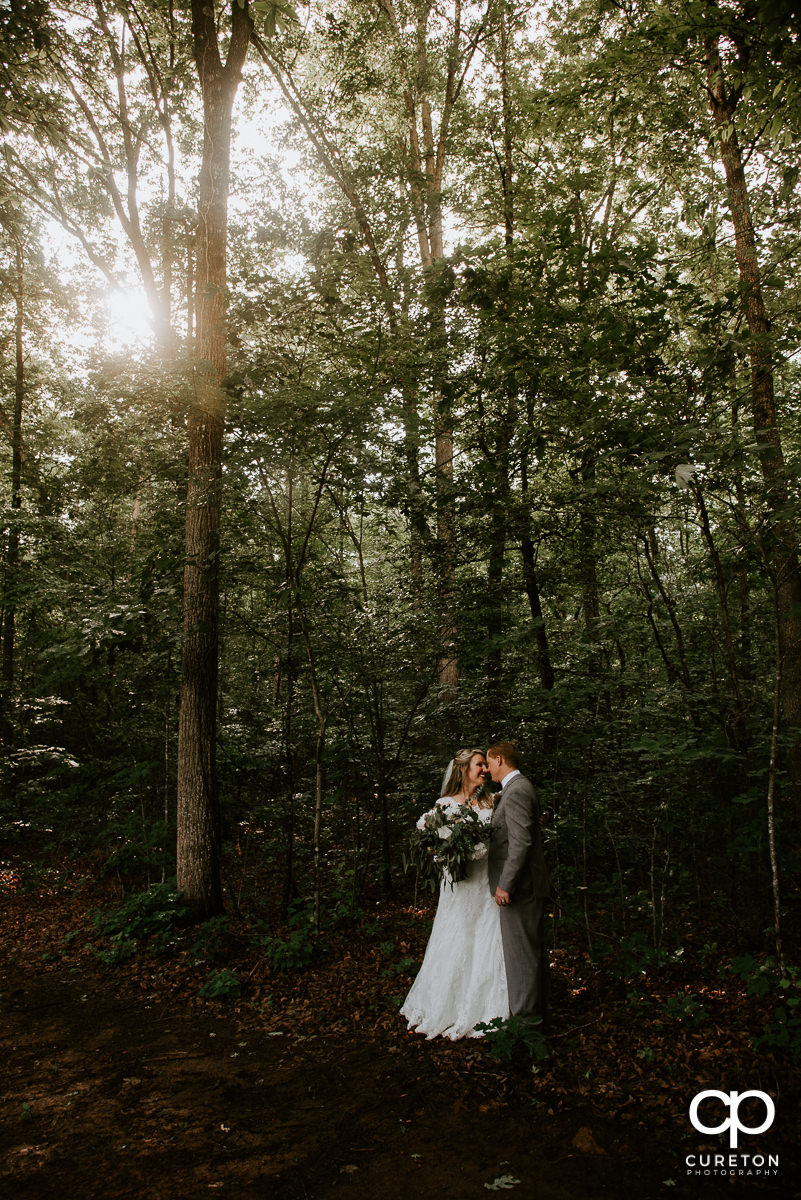 Bride and groom dancing in the forest in Greenville,SC.