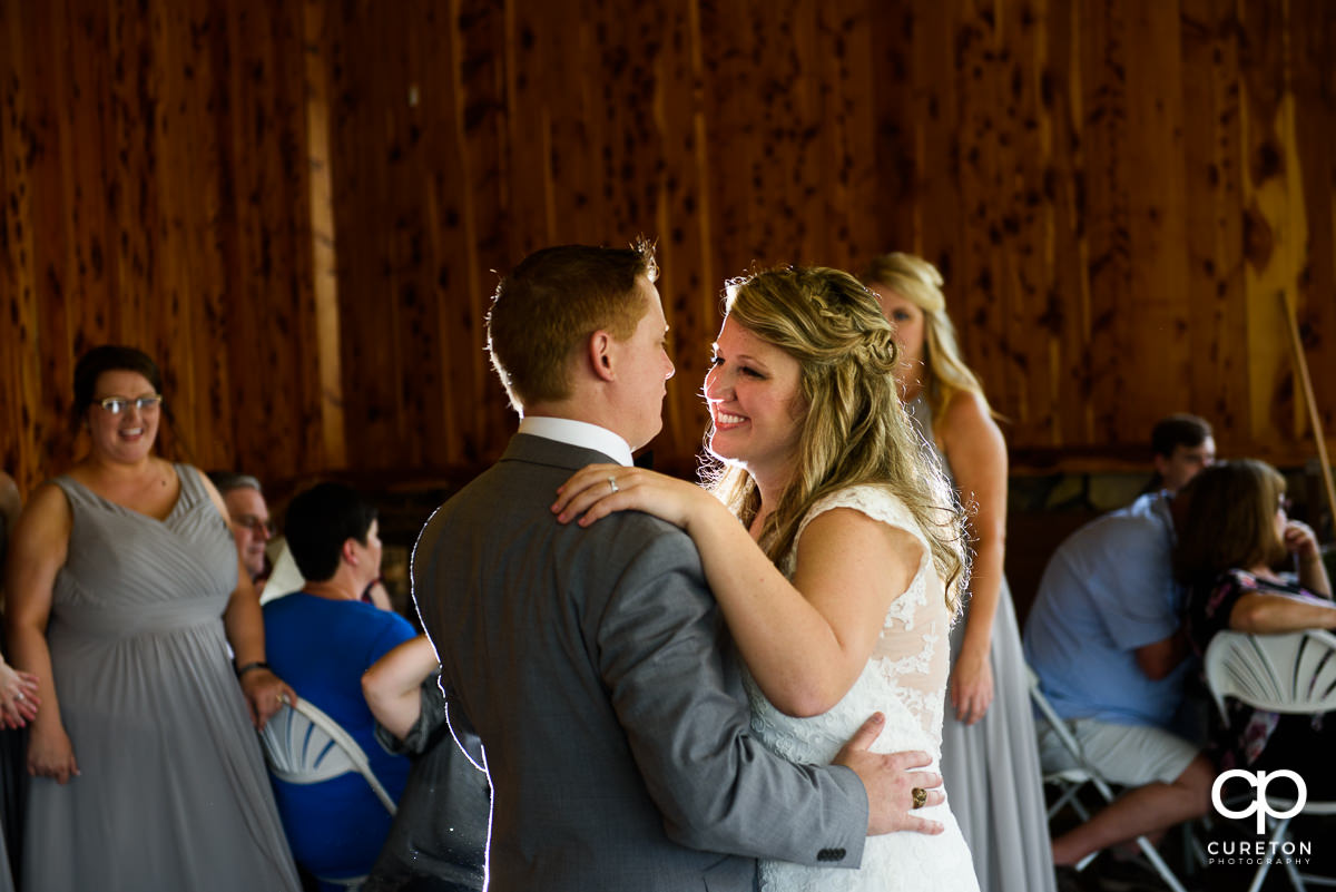 Bride and groom first dance at the wedding reception at The Hollow at Paris Mountain.