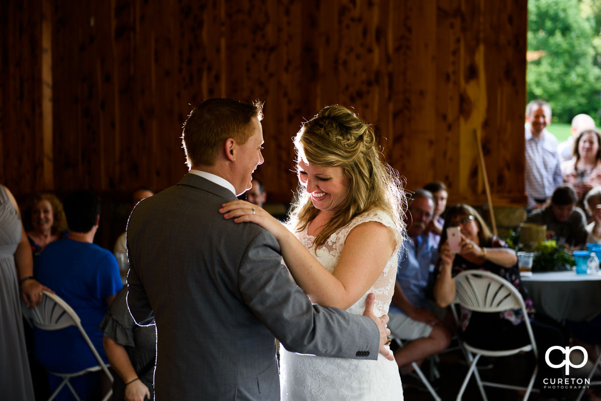 Bride and groom sharing a first dance.