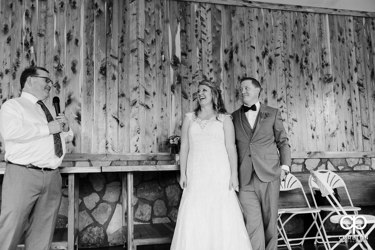 Wedding guests being welcomed by the bride's father.