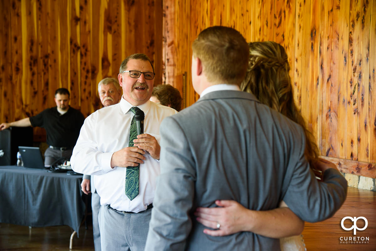 Bride's dad giving a speech at he wedding reception at Hollow at Paris Mountain in Greenville,SC.