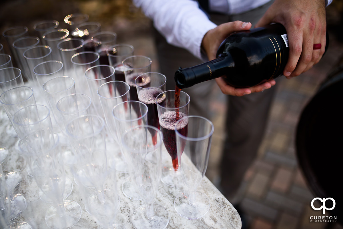 Wine being poured for the toast.