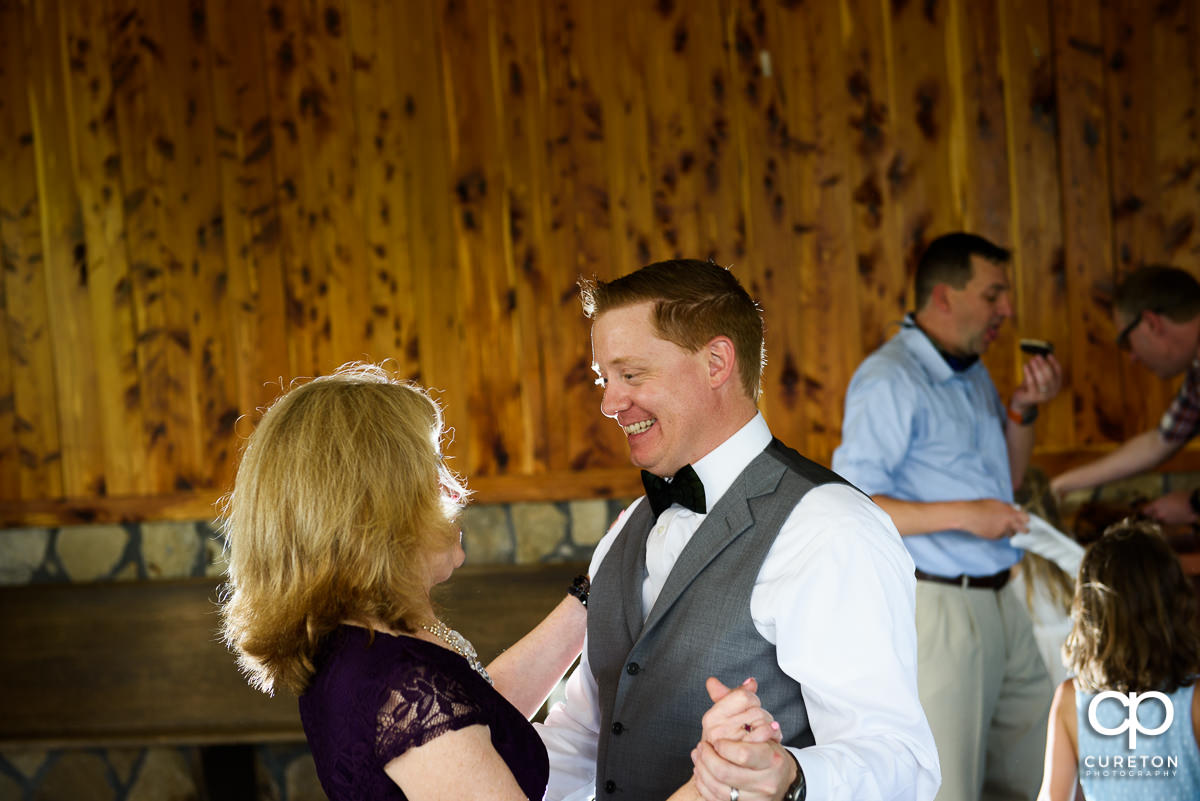 Groom dancing with his mother.