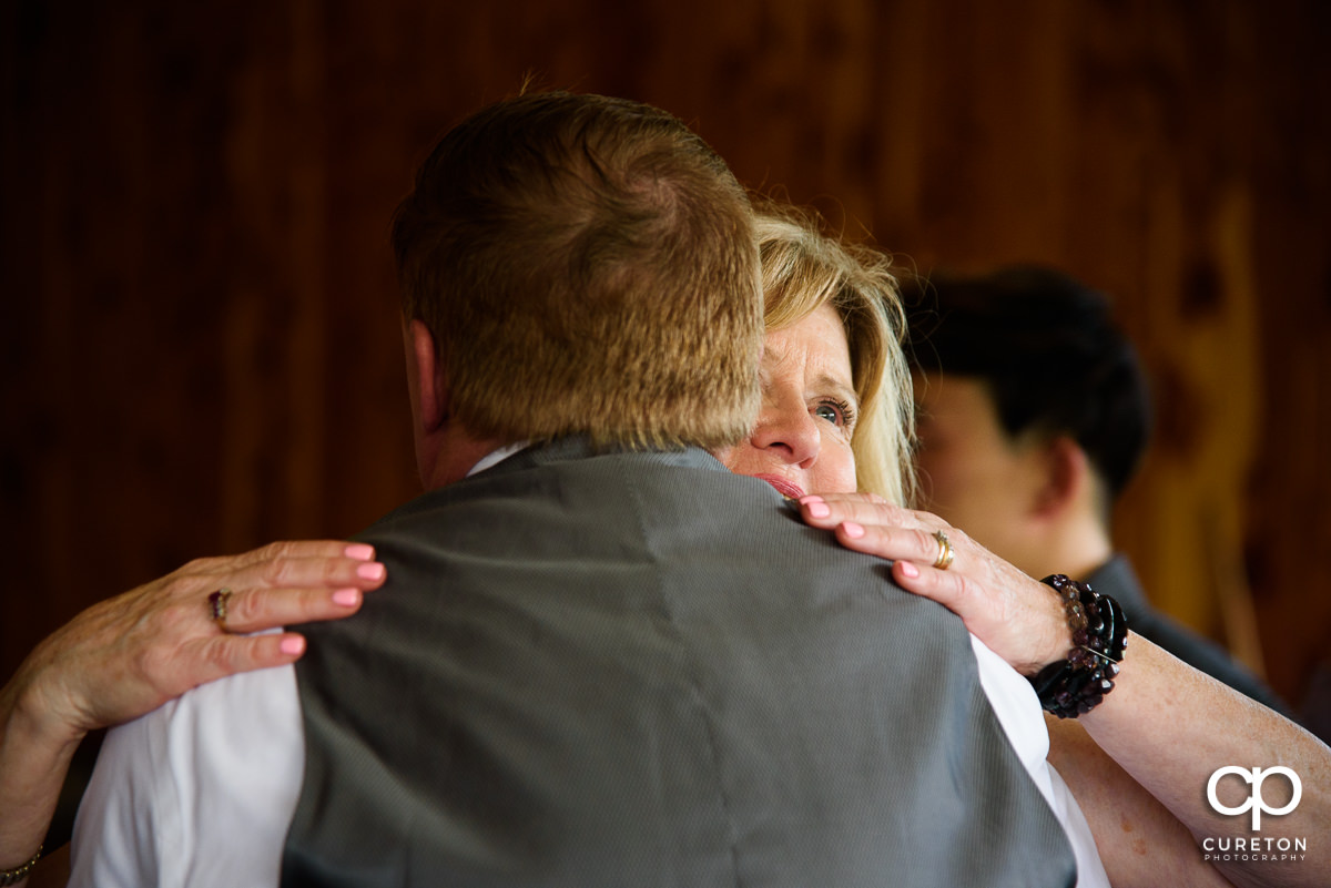 Groom's mom dancing wth her son.