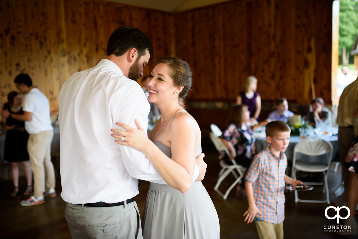 Wedding guests dancing at the Hollow at Paris Mountain reception in Greenville,SC.