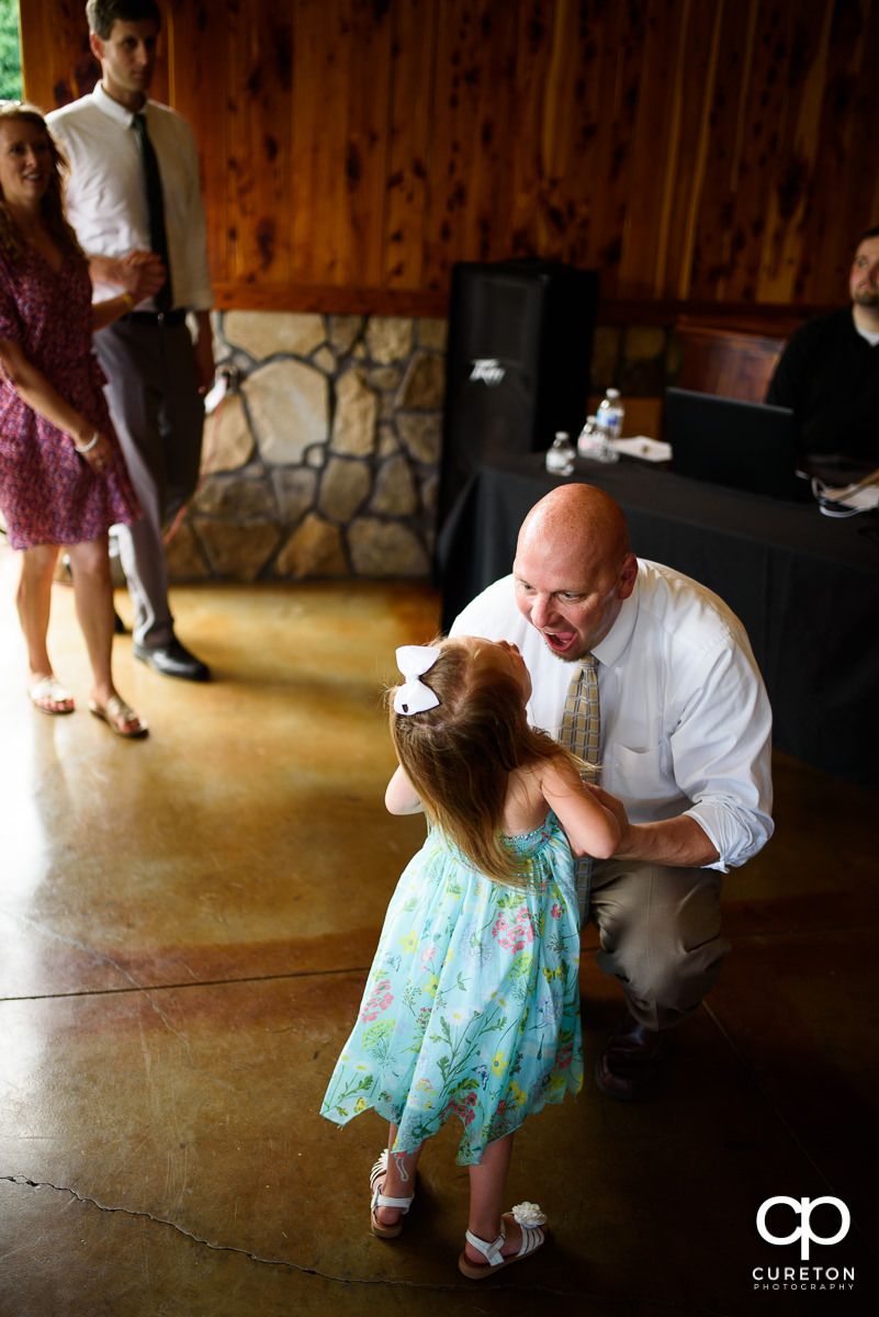 Wedding guests dancing at the Hollow at Paris Mountain reception in Greenville,SC.