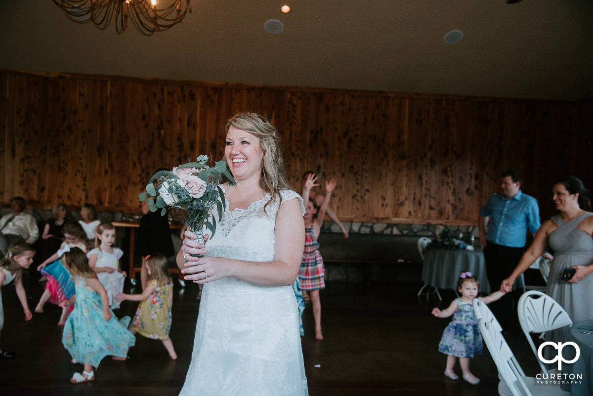 Bride tossing the bouquet.