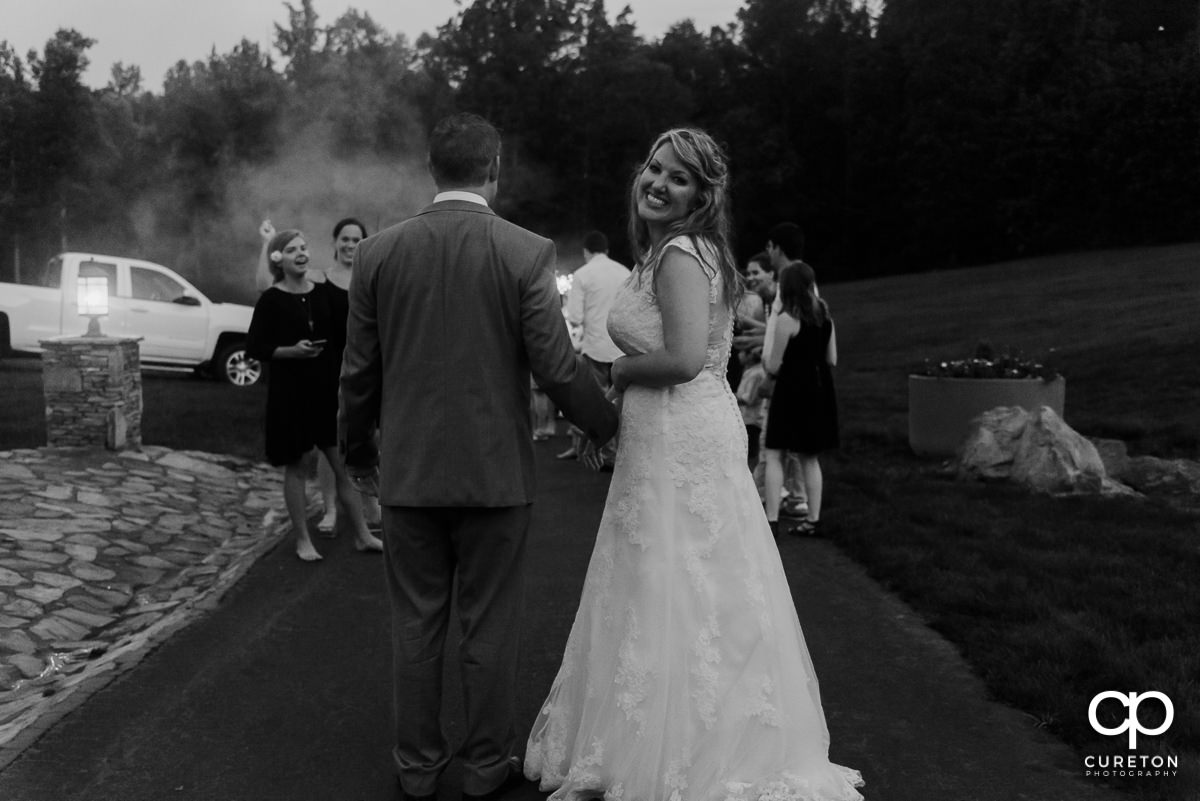 Bride and groom making a grand exit.