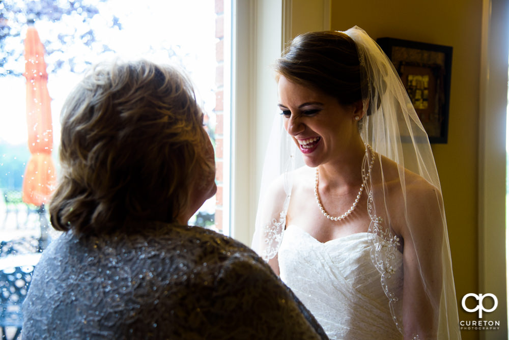 Bride and her mom sharing a pre-wedding moment.