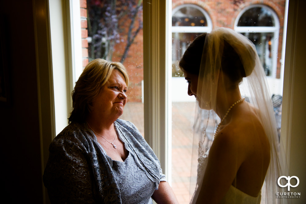 Bride and her mom sharing a pre-wedding moment.