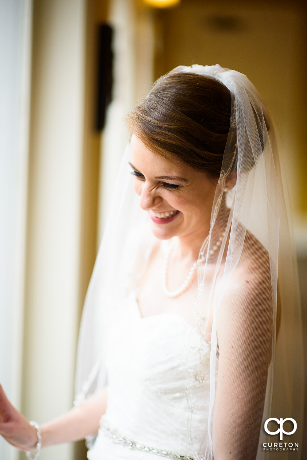 Bride in wonderful window light.