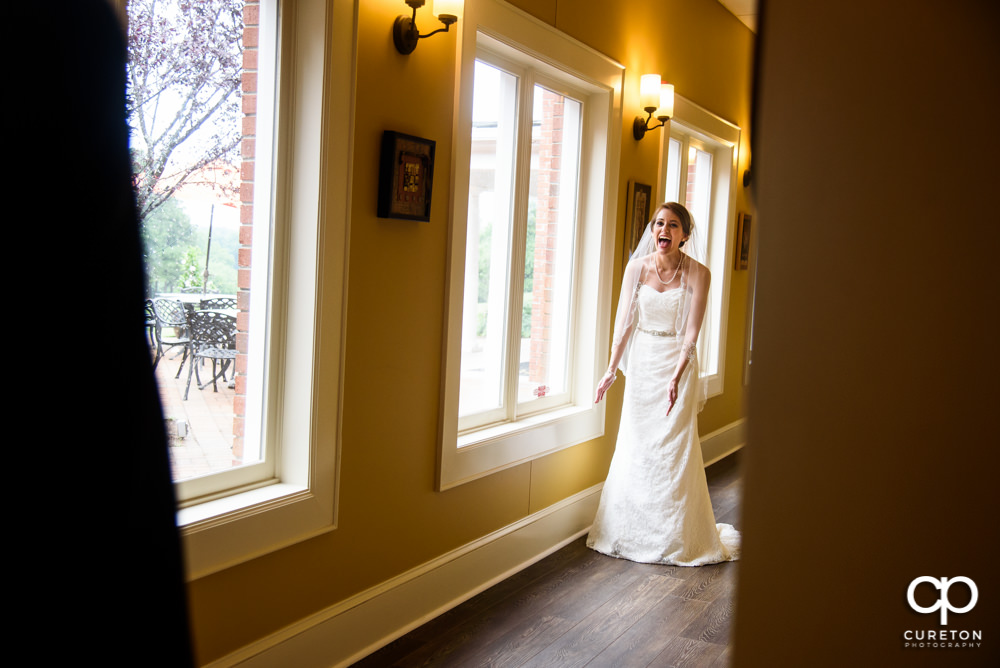 Bride sees her dad during a first look before the wedding.