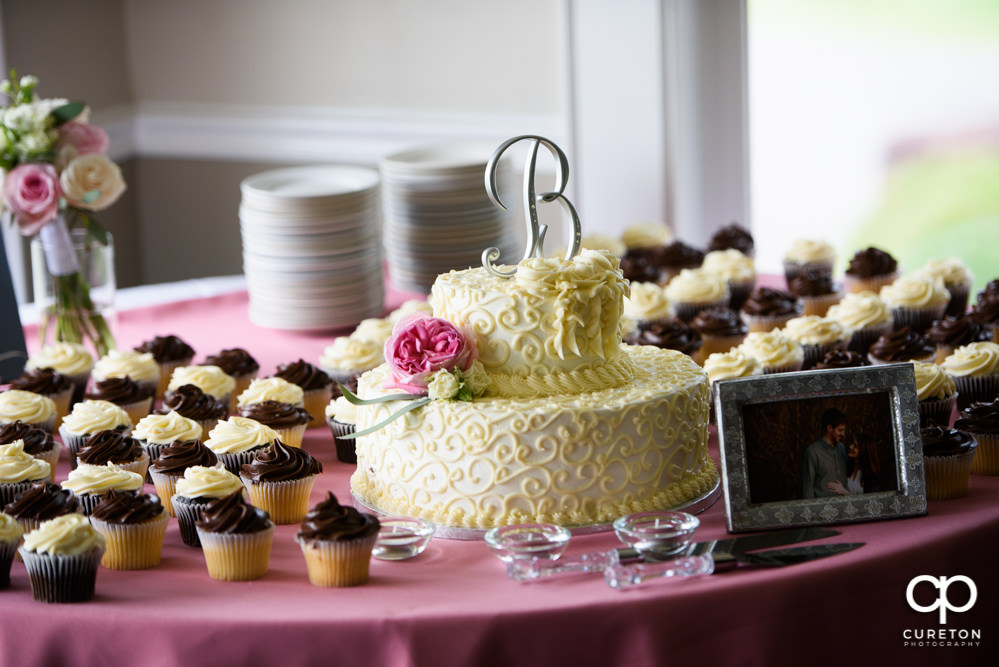 Wedding cake and cupcakes.