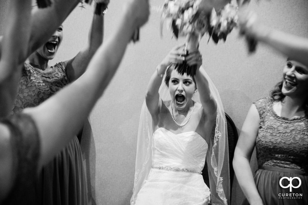 Bride and bridesmaids having fun before the ceremony.