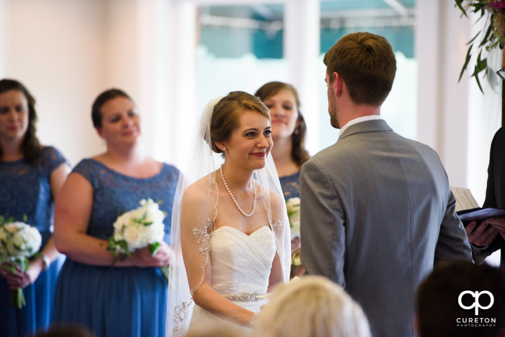Wedding ceremony at Holly Tree Country Club inside.