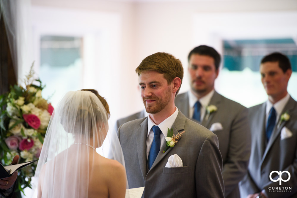 Wedding ceremony at Holly Tree Country Club inside.