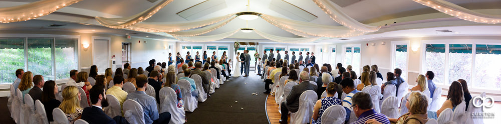 Wedding ceremony at Holly Tree Country Club inside.