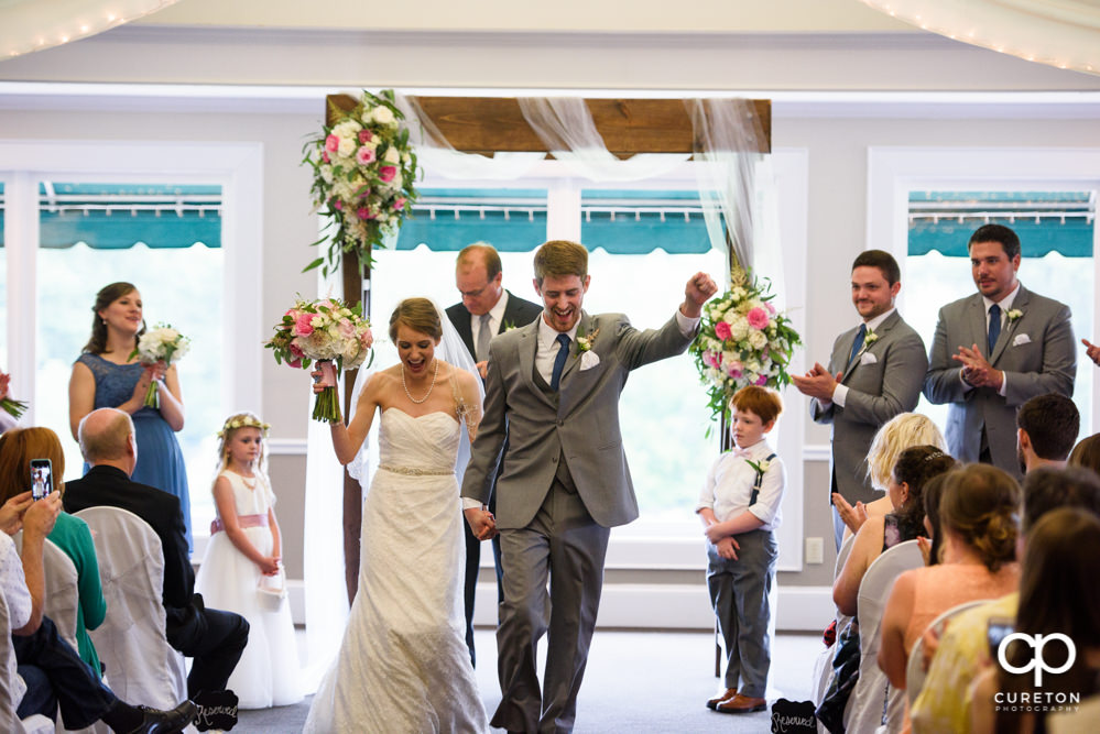 Wedding ceremony at Holly Tree Country Club inside.