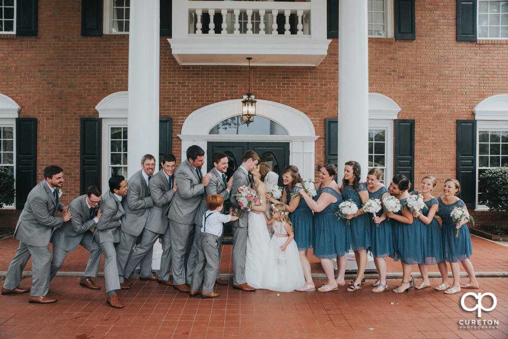 Wedding party in front of Holly Tree Country Club after the wedding ceremony.