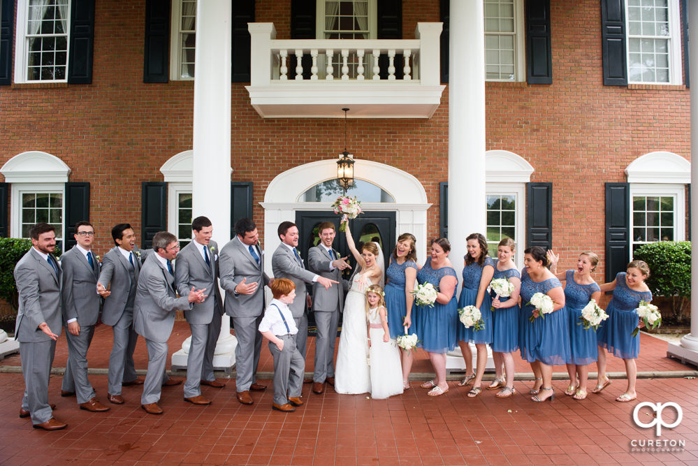 Wedding party in front of Holly Tree Country Club after the wedding ceremony.