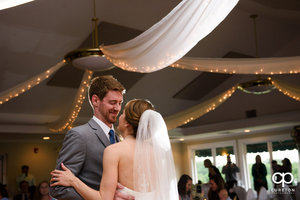 Bride and groom having their first dance at the wedding reception.