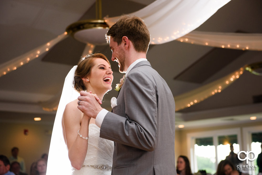 Bride and groom having their first dance at the wedding reception.