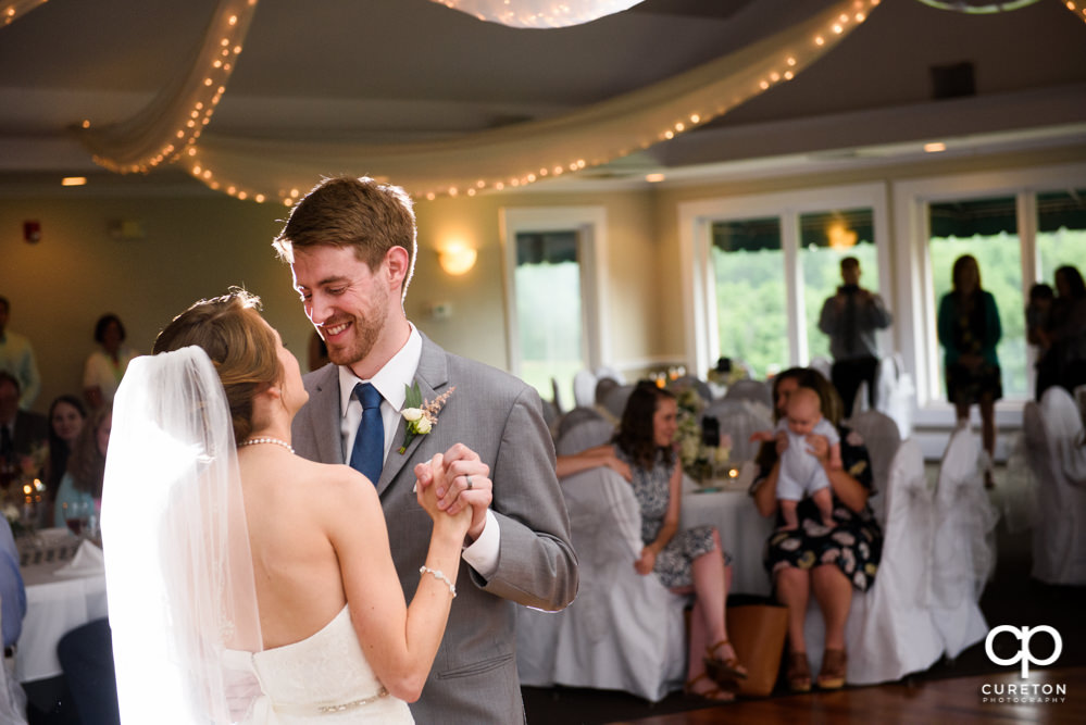Bride and groom having their first dance at the wedding reception.